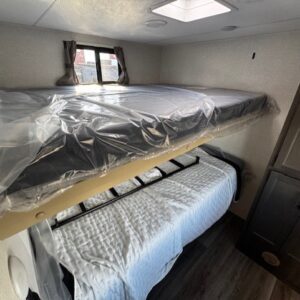 Bunk beds in a compact RV interior.