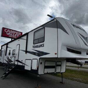 White Vengeance RV parked at dealership.